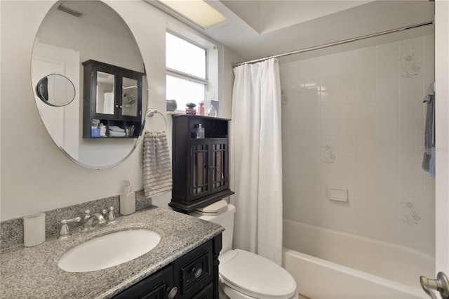 full bathroom featuring toilet, vanity, and shower / bathtub combination with curtain