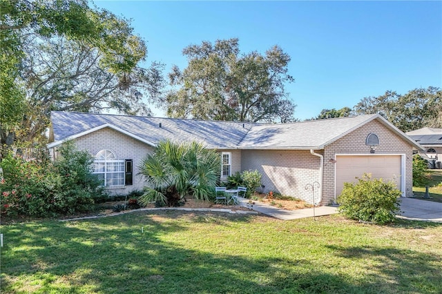 ranch-style house featuring a garage, brick siding, concrete driveway, and a front lawn