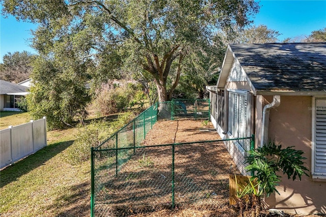 view of yard featuring an outbuilding and a fenced backyard