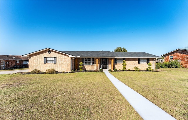 ranch-style home with a front yard