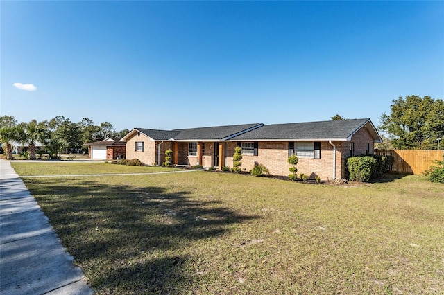 ranch-style home with a front lawn