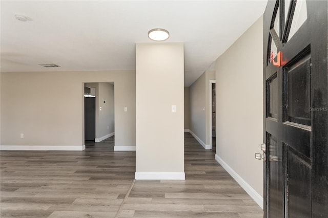 unfurnished room featuring hardwood / wood-style floors