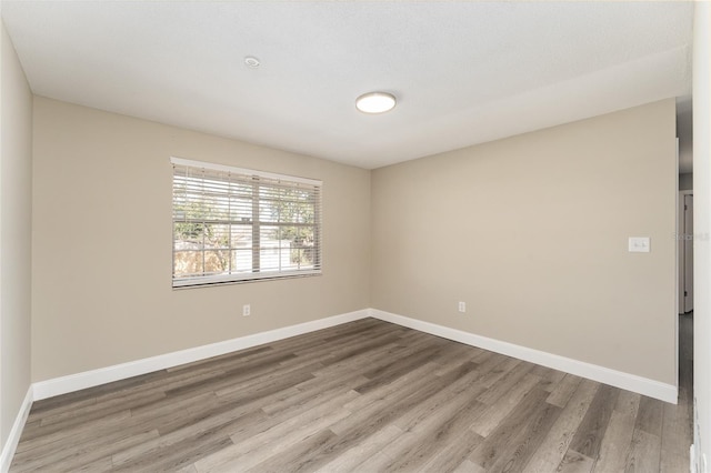 empty room featuring hardwood / wood-style floors