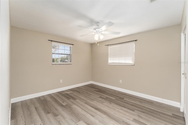 unfurnished room with light hardwood / wood-style flooring and ceiling fan