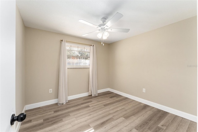 unfurnished room featuring ceiling fan and light wood-type flooring