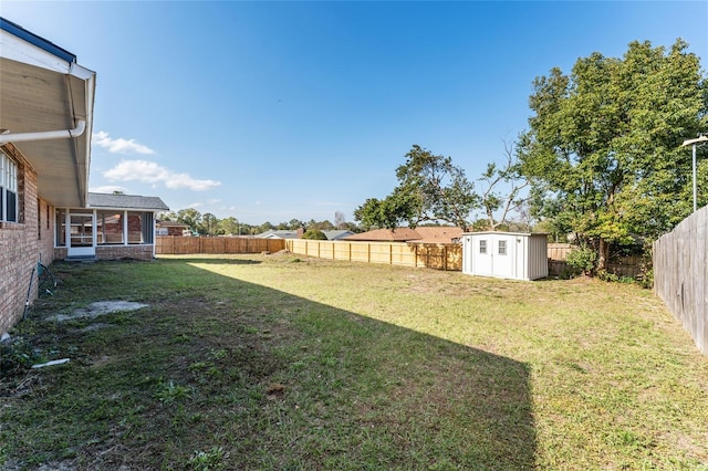 view of yard with a storage unit