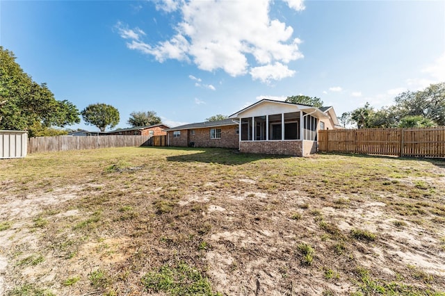 view of yard featuring a sunroom