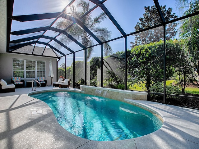 view of swimming pool featuring pool water feature, glass enclosure, and a patio area