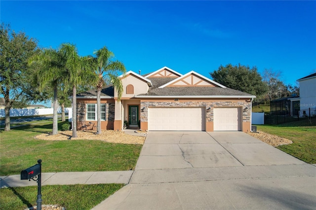 view of front of house with a garage and a front yard