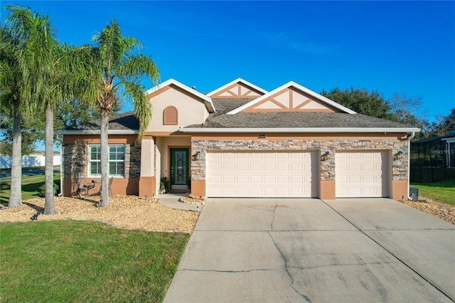 view of front facade featuring a front yard and a garage