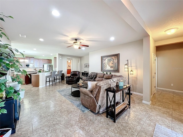 living room with ceiling fan