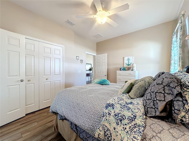 bedroom with ceiling fan, a closet, and hardwood / wood-style flooring