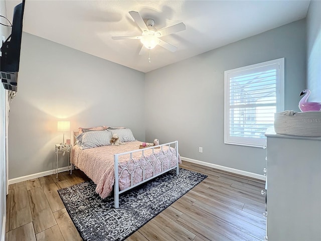 bedroom featuring ceiling fan and hardwood / wood-style floors