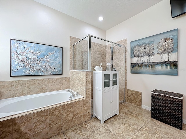 bathroom with separate shower and tub