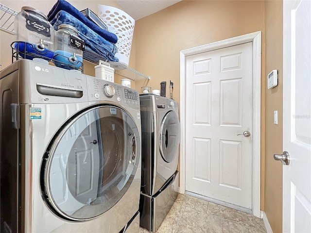 washroom with washer and clothes dryer