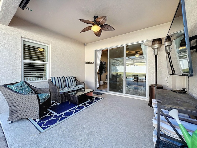 view of patio featuring ceiling fan and an outdoor living space