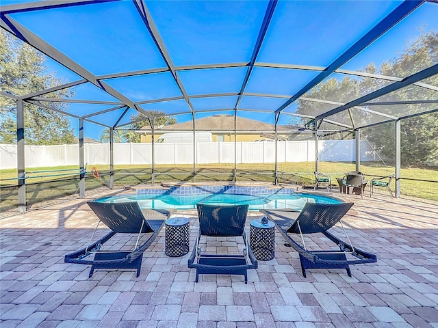 view of patio featuring a fenced in pool and glass enclosure