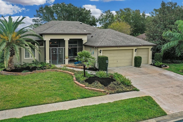 view of front of property with a front yard, roof with shingles, stucco siding, concrete driveway, and a garage