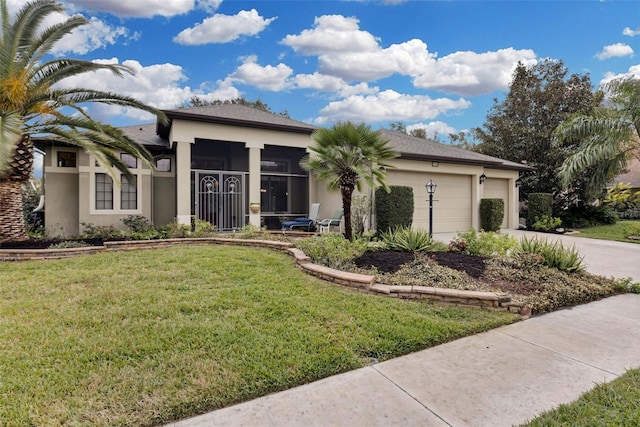 view of front facade featuring a front yard and a garage