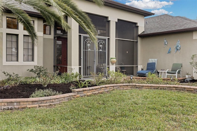 property entrance featuring a yard