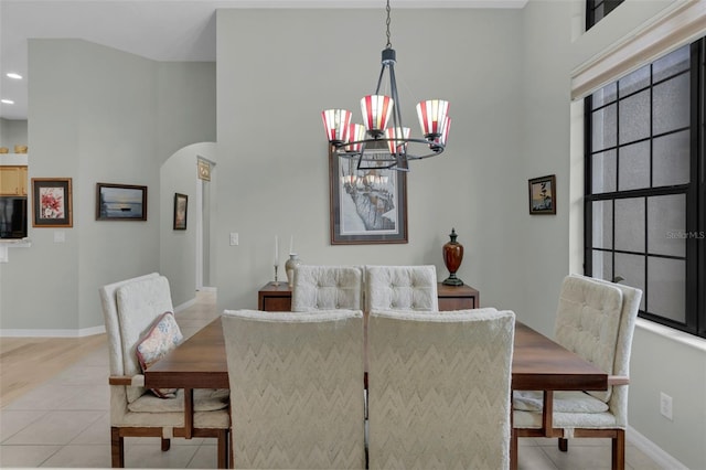 tiled dining area with a notable chandelier