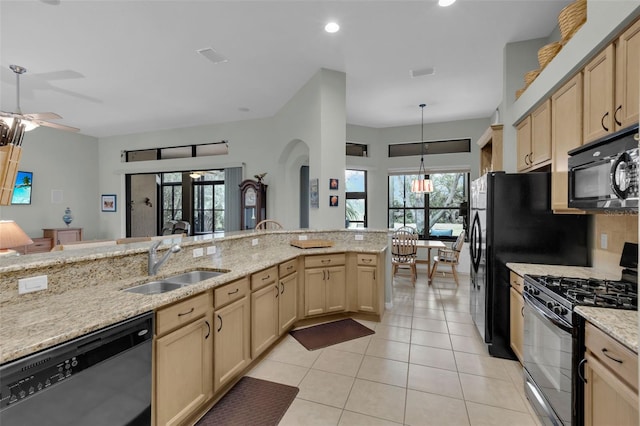 kitchen with ceiling fan, sink, light brown cabinetry, light tile patterned flooring, and black appliances