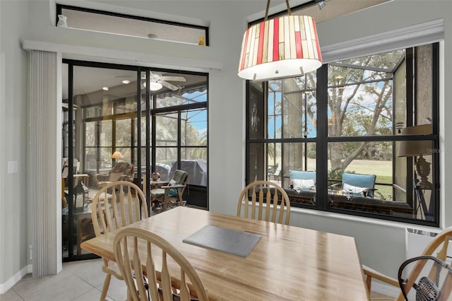 tiled dining area featuring ceiling fan