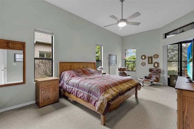 bedroom with light colored carpet and ceiling fan