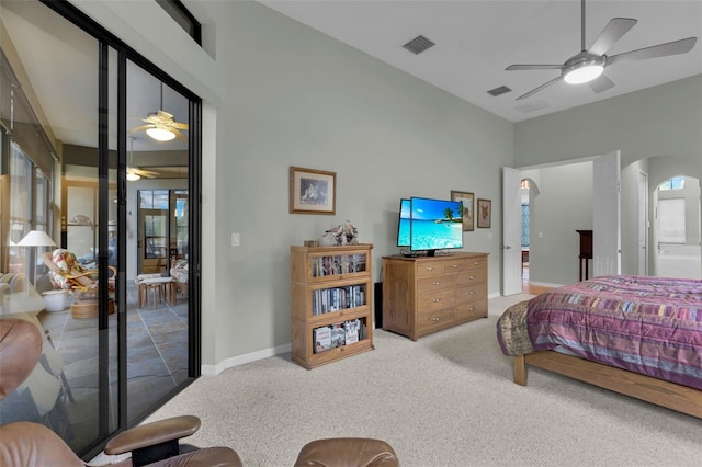 carpeted bedroom featuring ceiling fan and connected bathroom