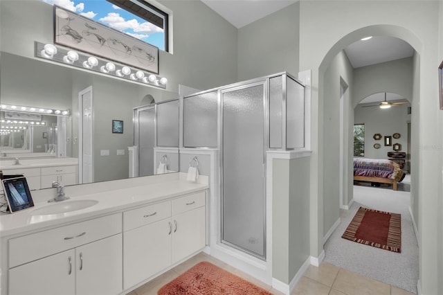 bathroom featuring vanity, tile patterned floors, a shower with door, and ceiling fan