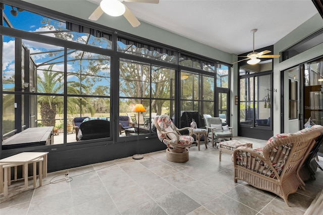 sunroom featuring ceiling fan