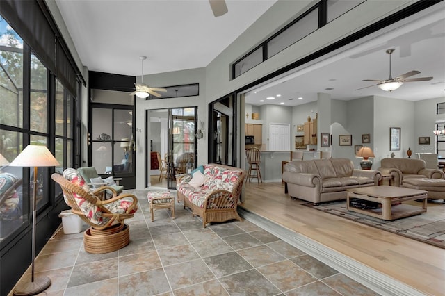 sunroom with ceiling fan