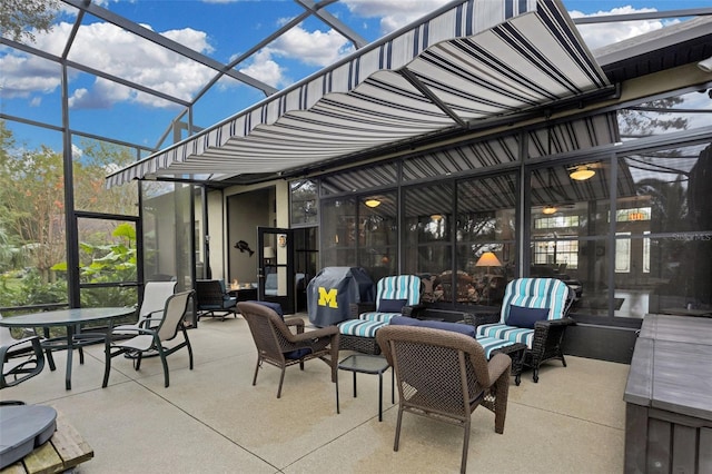 view of patio / terrace with glass enclosure, a grill, and an outdoor hangout area