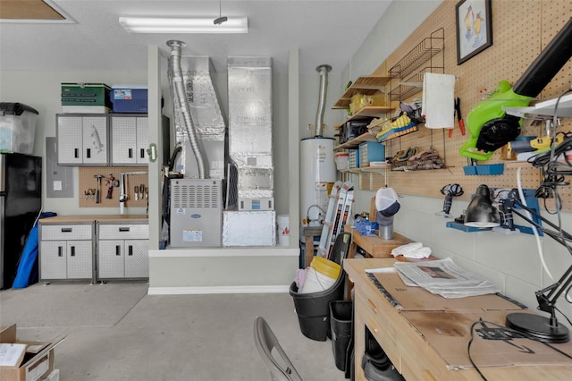 interior space featuring a workshop area and water heater