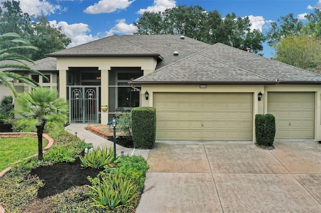 27238 Stoney Brook Dr, Leesburg, FL 34748 - ranch-style home with an attached garage, a shingled roof, stucco siding, and concrete driveway