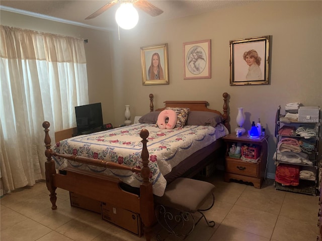 tiled bedroom with ceiling fan