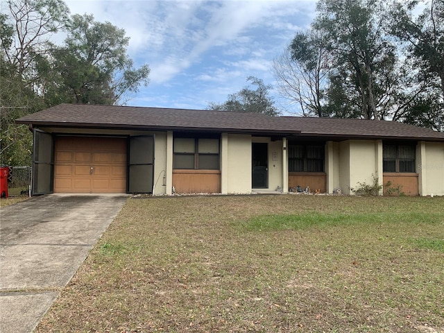 ranch-style house with a front lawn and a garage