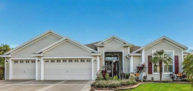 view of front of home featuring a garage and a front lawn