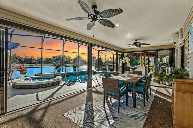 sunroom / solarium featuring a water view, a pool, and a wall mounted AC