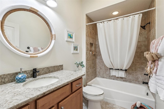 full bathroom with tile patterned flooring, vanity, shower / tub combo, and toilet