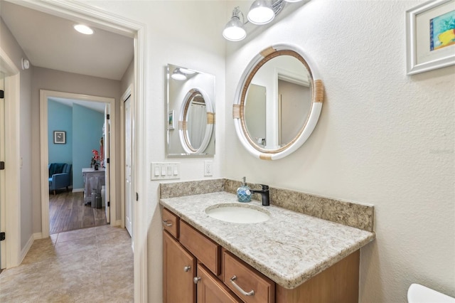 bathroom with tile patterned floors and vanity