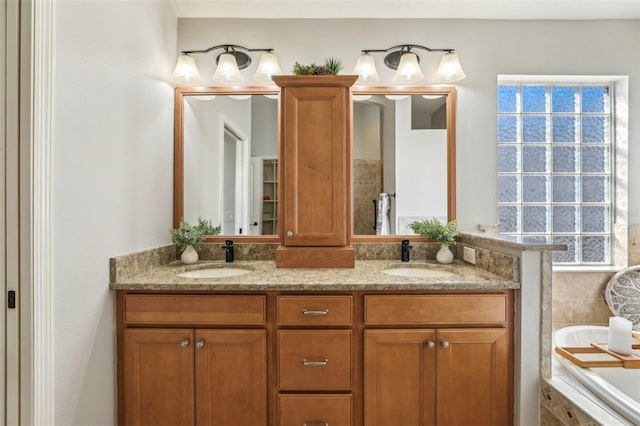 bathroom featuring vanity and tiled tub