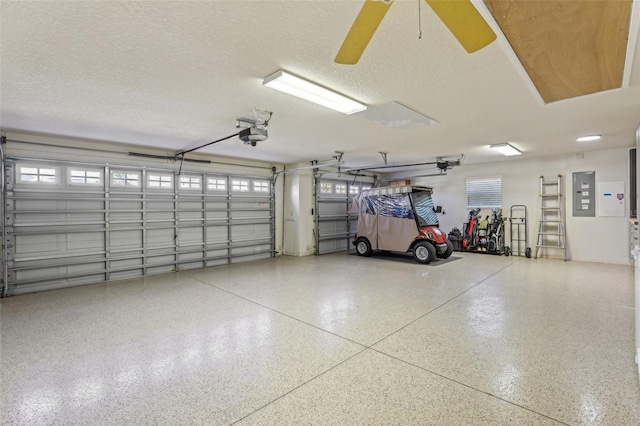 garage featuring a garage door opener and electric panel