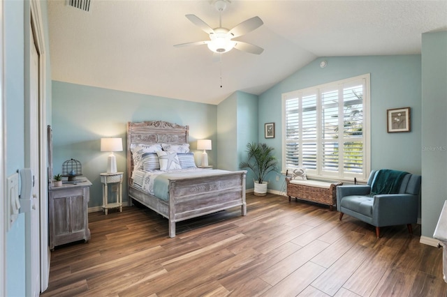 bedroom with vaulted ceiling, hardwood / wood-style floors, and ceiling fan