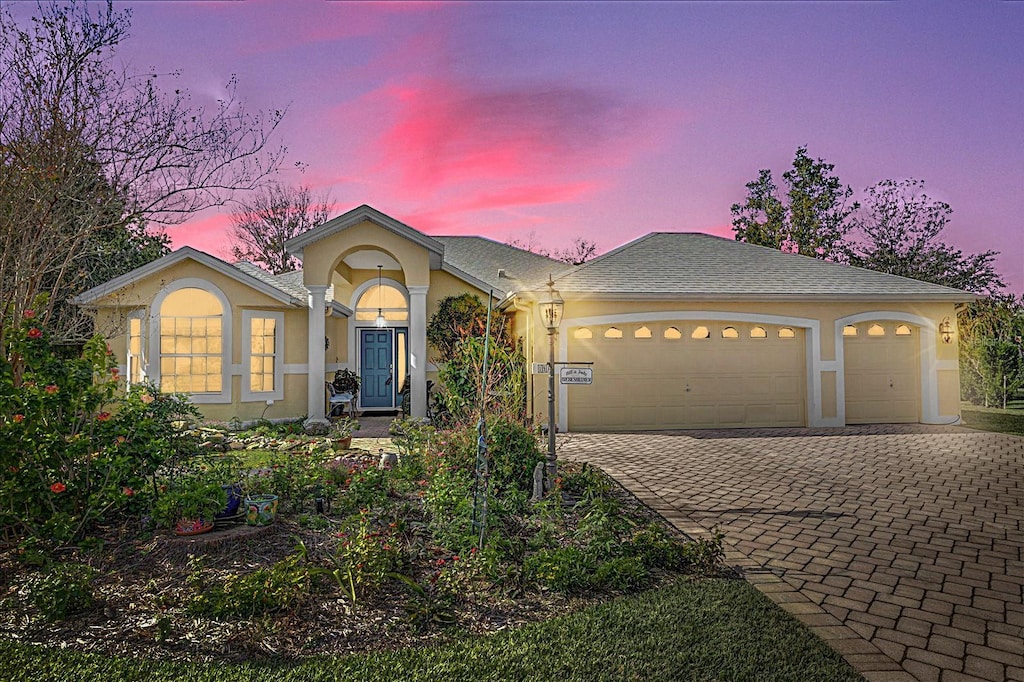 view of front of property featuring a garage