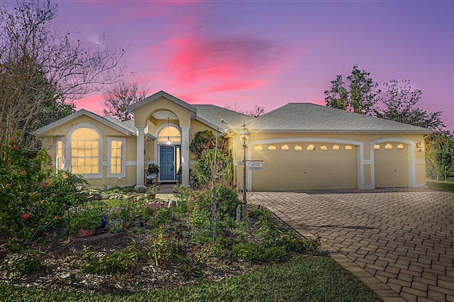 view of front of property featuring a garage