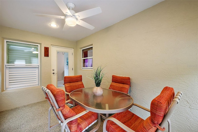 dining space featuring ceiling fan