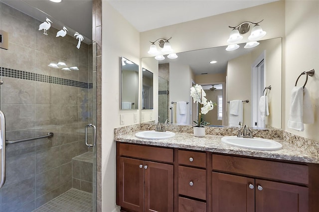 bathroom featuring walk in shower and vanity