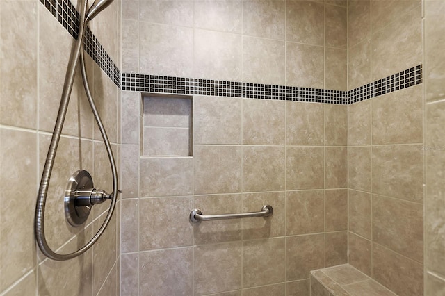 bathroom featuring tiled shower