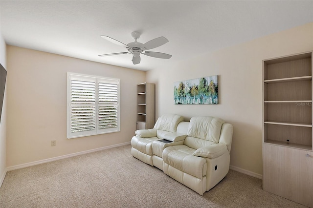 living room featuring ceiling fan and carpet flooring